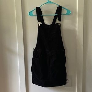 Black, corduroy skirt bib dress.